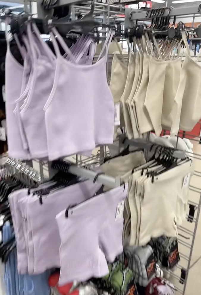 Purple and beige workout sets on the rack at Five Below