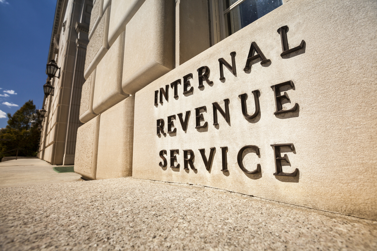 A close up of a sign that says Internal Revenue Service outside the IRS headquarters in Washington, D.C.