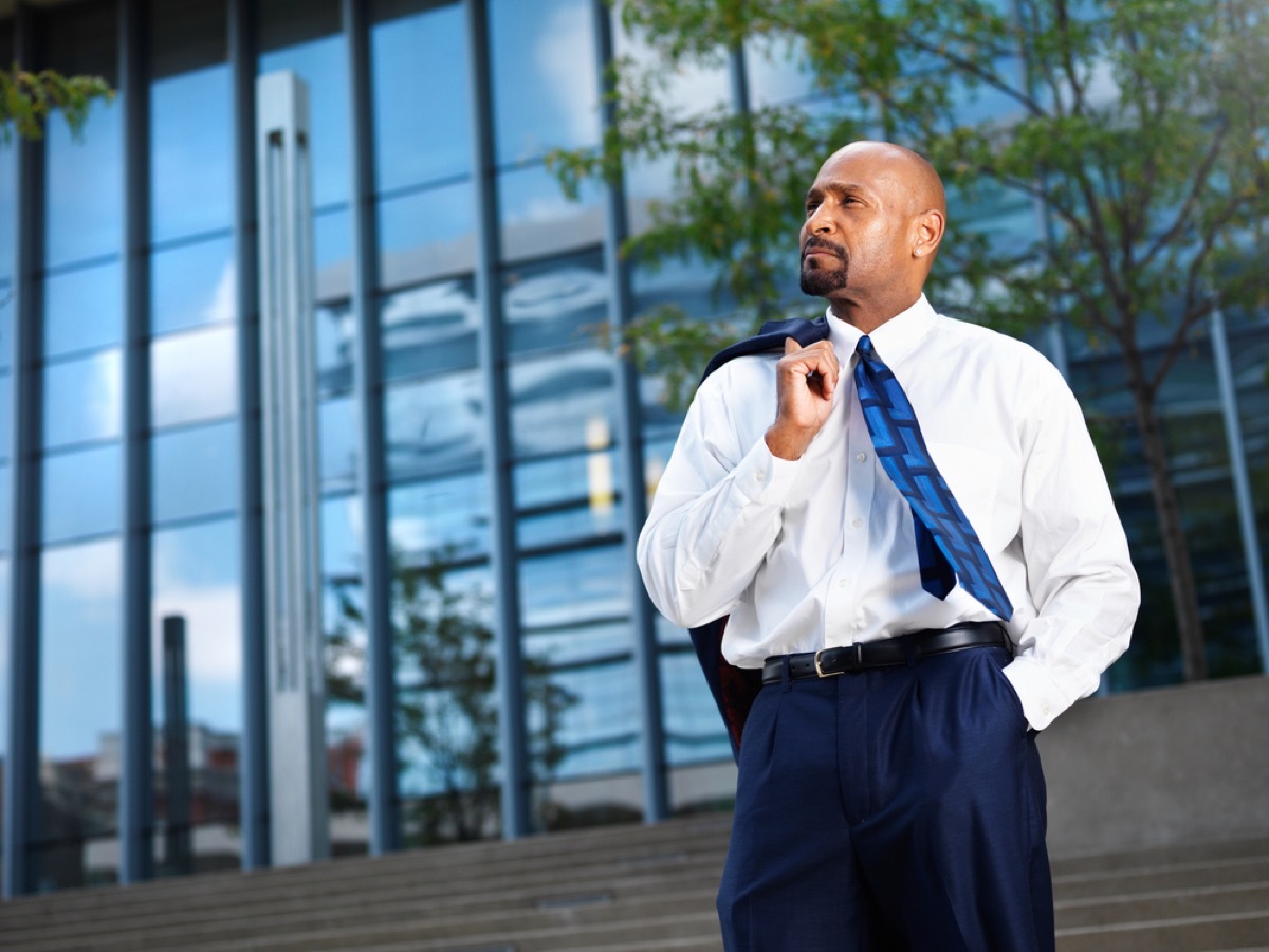 older man standing outdoors in suit, look better after 40