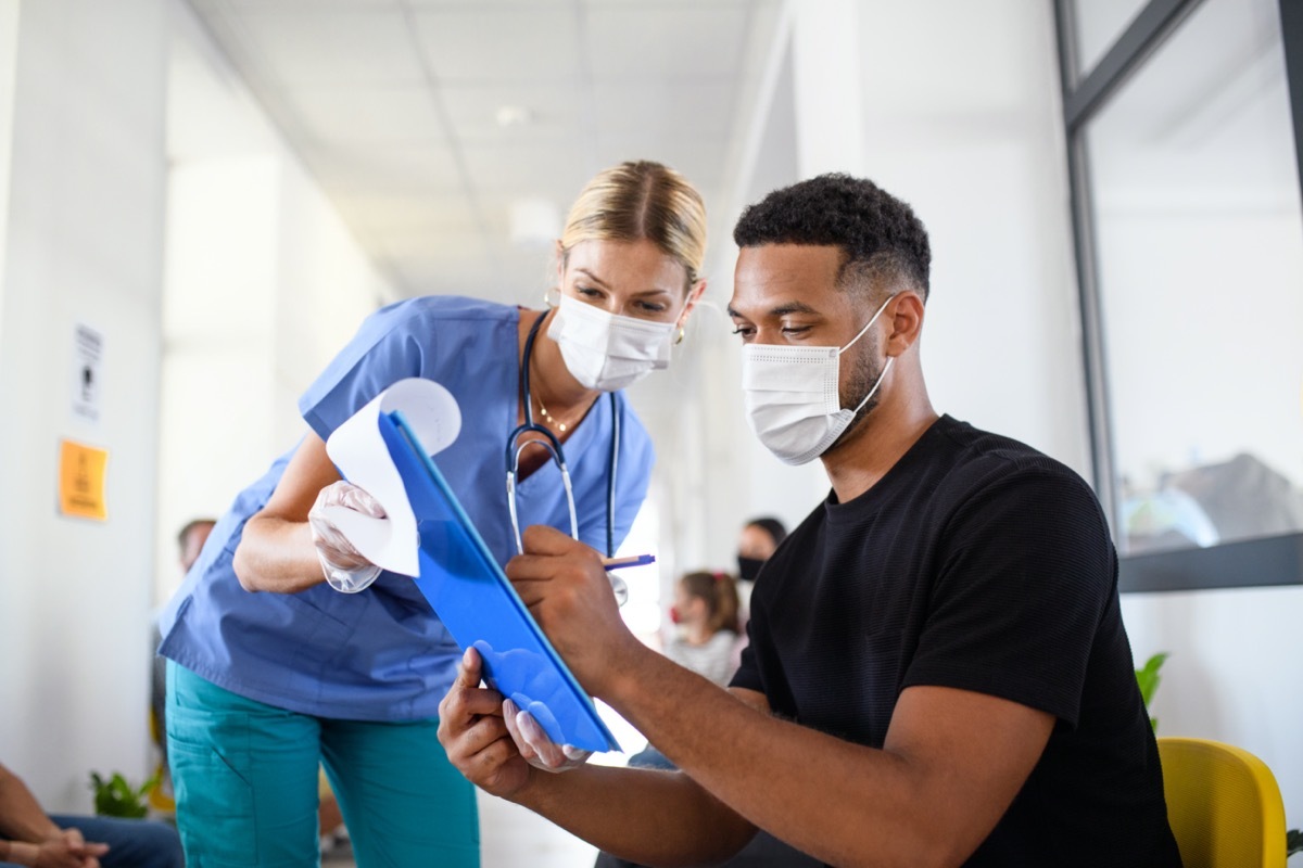 nurse and man with face masks