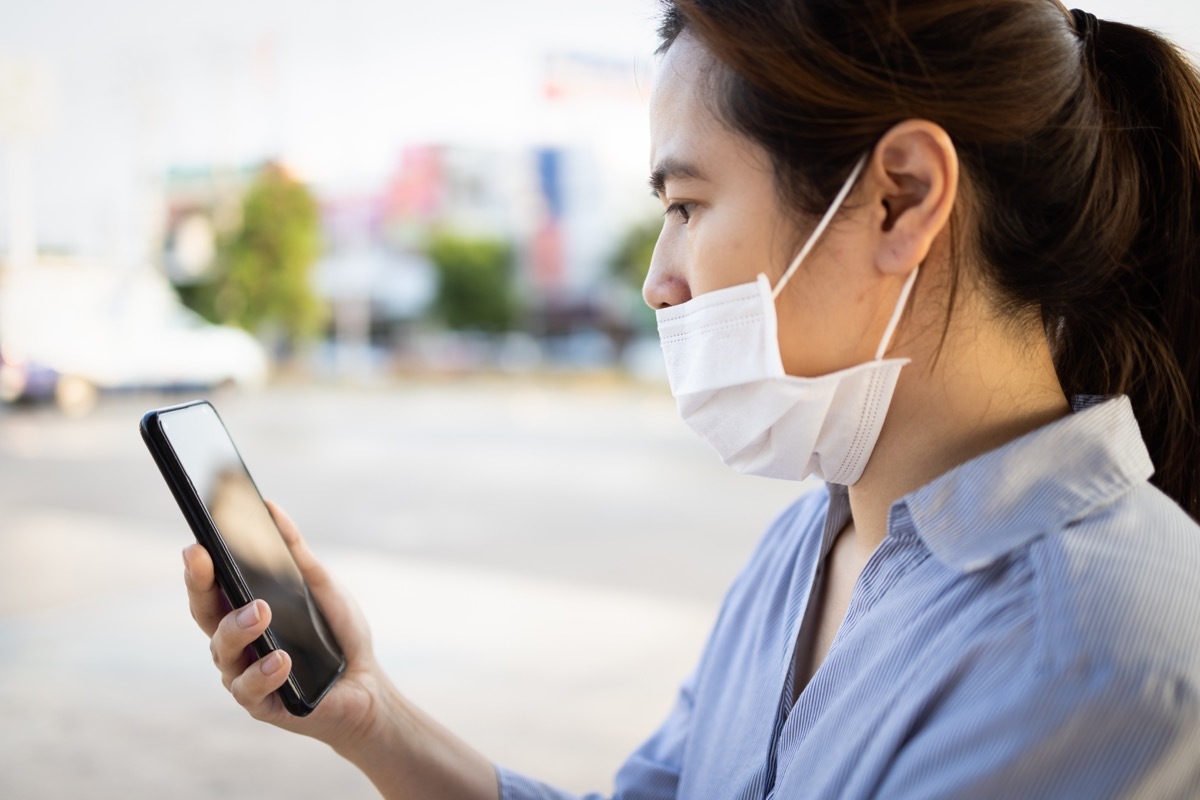 30-something asian woman wearing face mask without it covering her nose