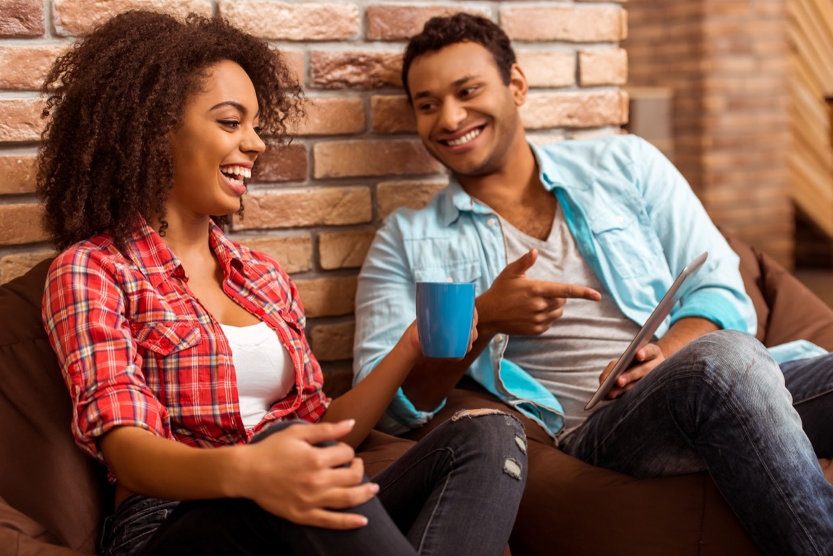 couple having fun while going through a list of 'questions to ask your partner'