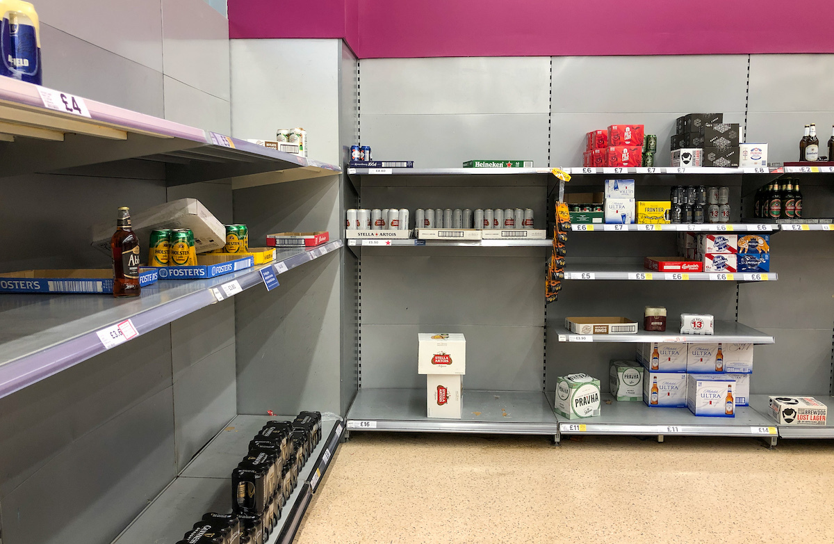 Empty shelves of beer and lager at a supermarket