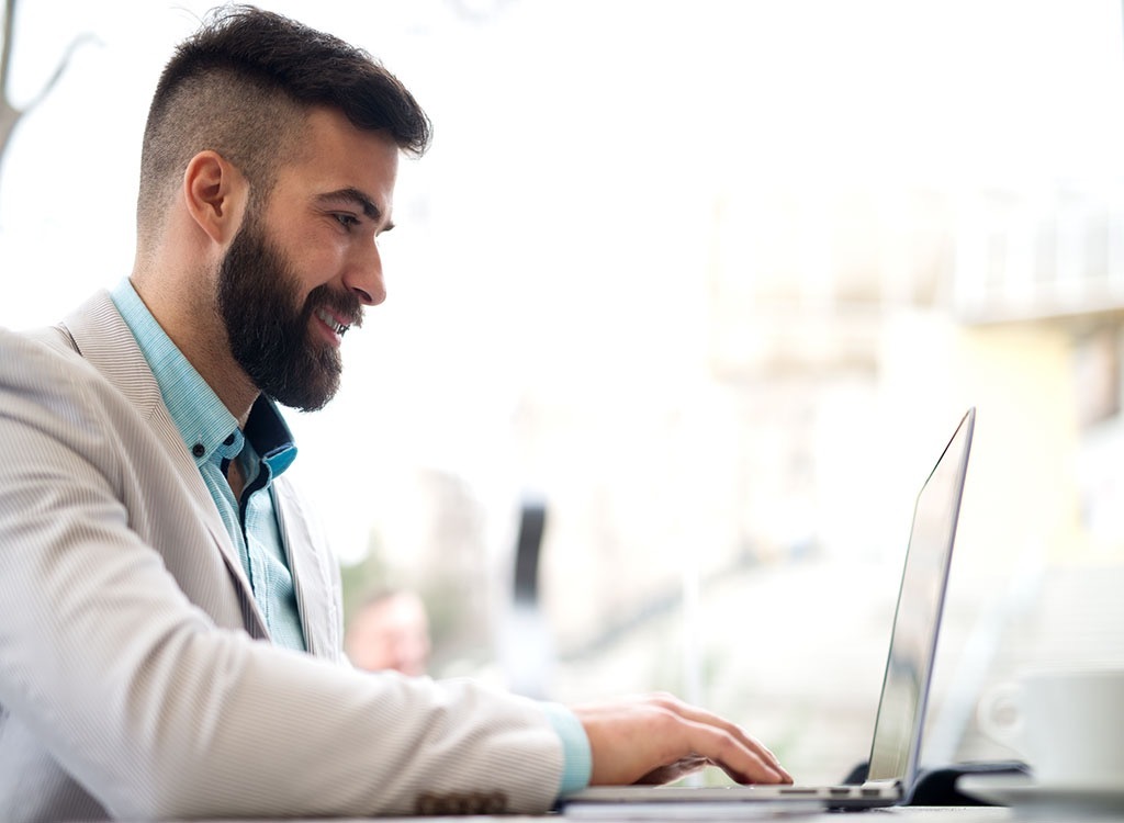 Man on Laptop 25 Years