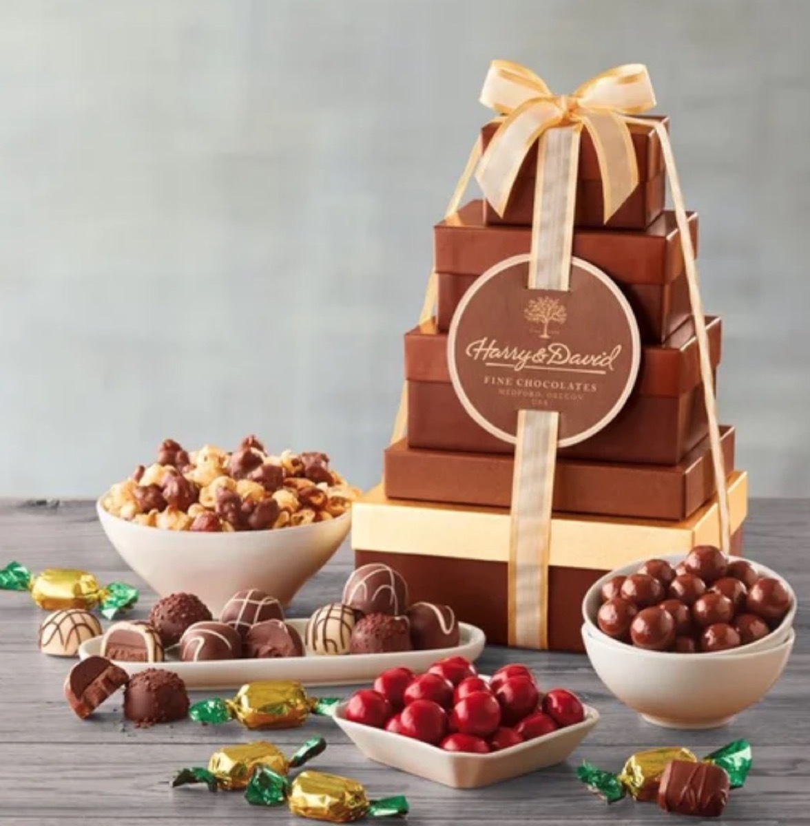 stacked brown boxes with bowls of candy in front of them