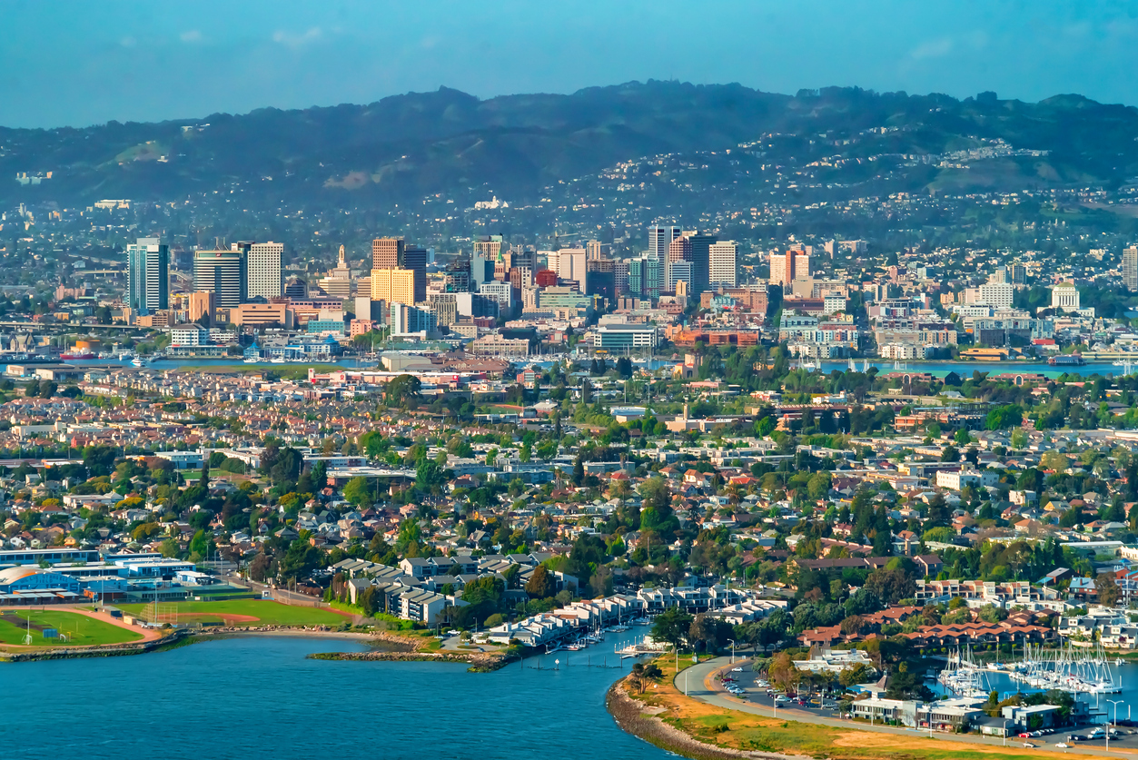 The skyline of Oakland, California from the bay.