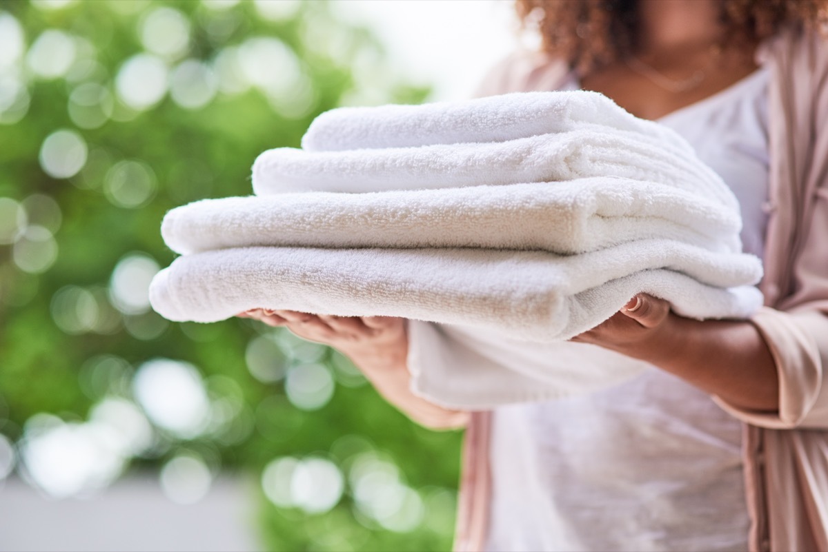 Shot of an unrecognizable woman doing laundry at home