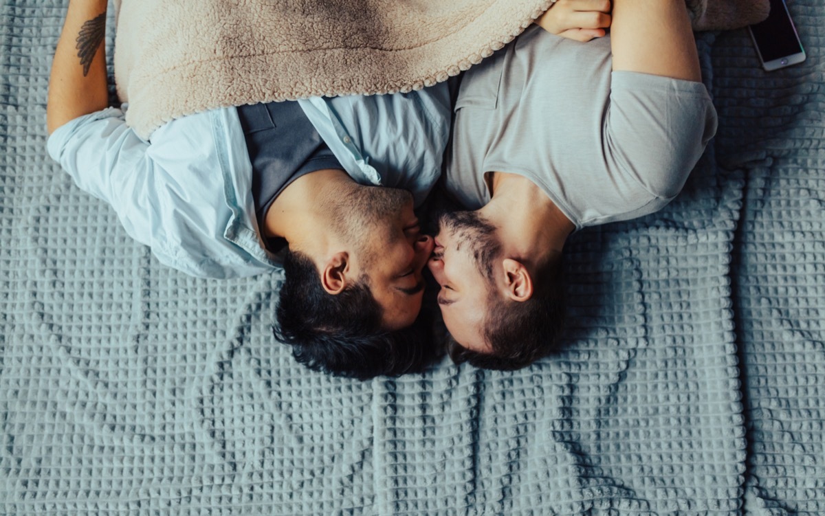 gay couple kissing before bed