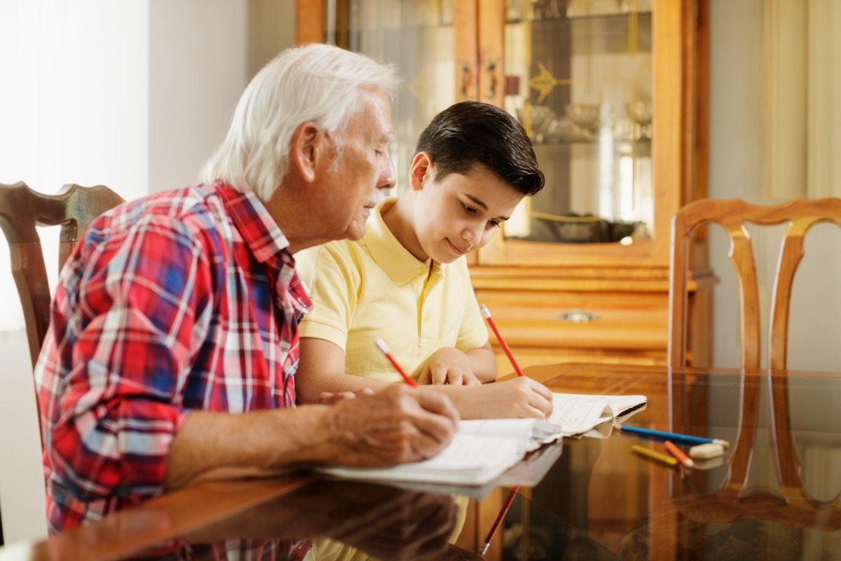 grandpa and grandson doing homework