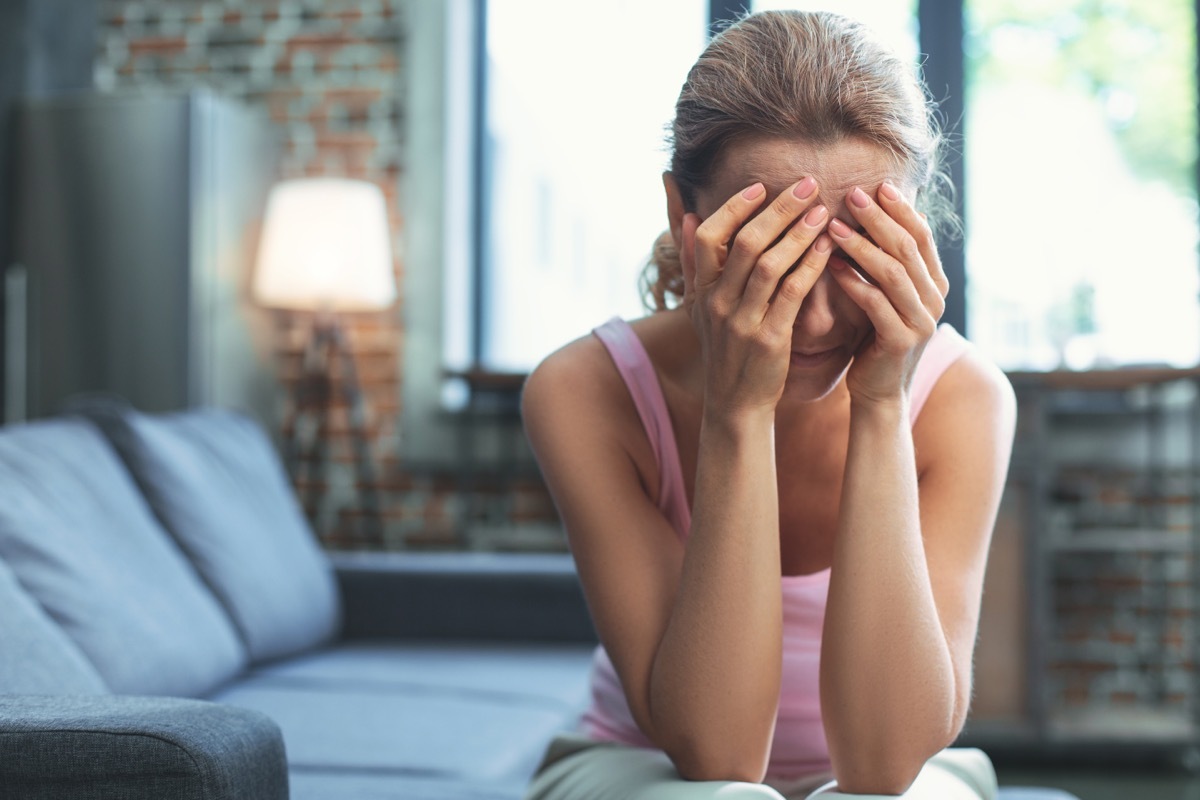 Girl Hiding Face in Hands