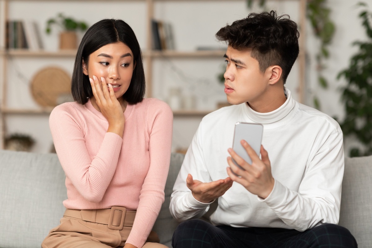 Woman in pink sweater guilty of cheating on her partner. 