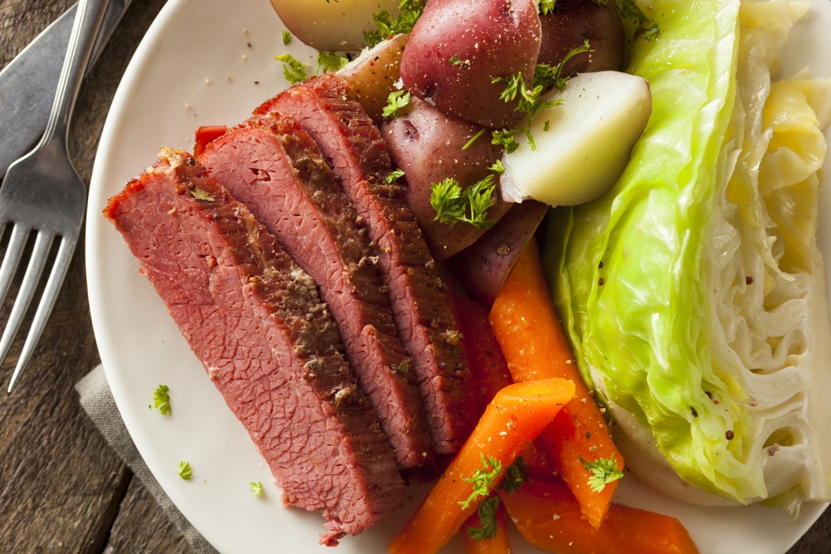 homemade corned beef and cabbage or a plate with carrots and potatoes