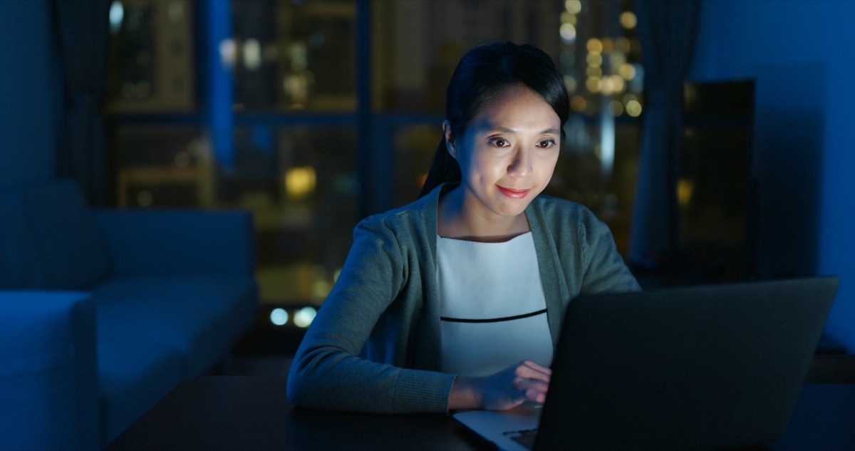 woman watching livestream at home