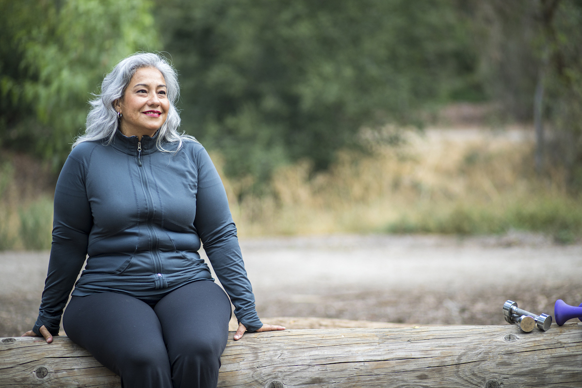 Older woman in teal sweatsuit