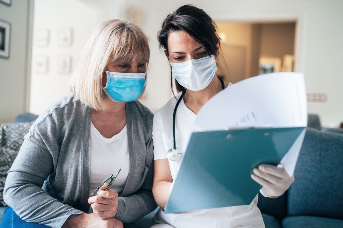 Female doctor consults mature patient during the quarantine for coronavirus