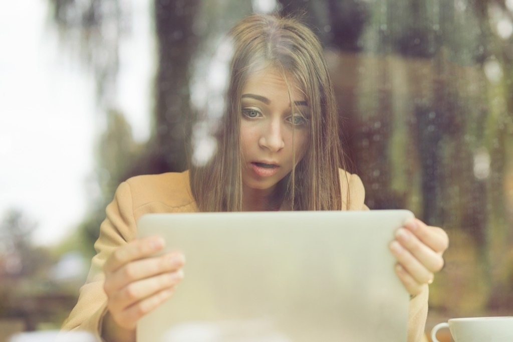 woman surprised through window