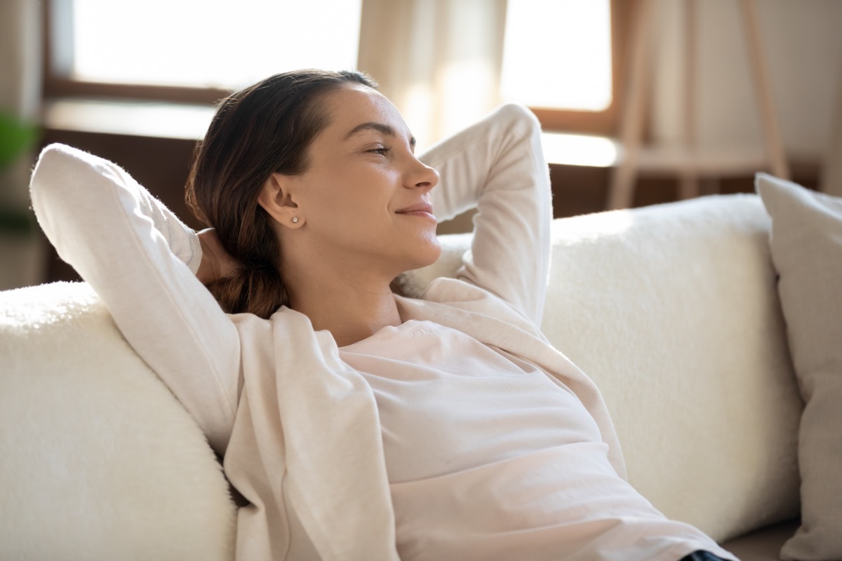 Woman Lounging on Couch