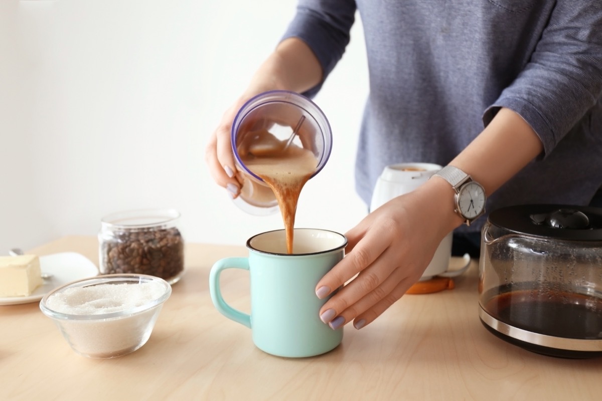 person making bulletproof coffee