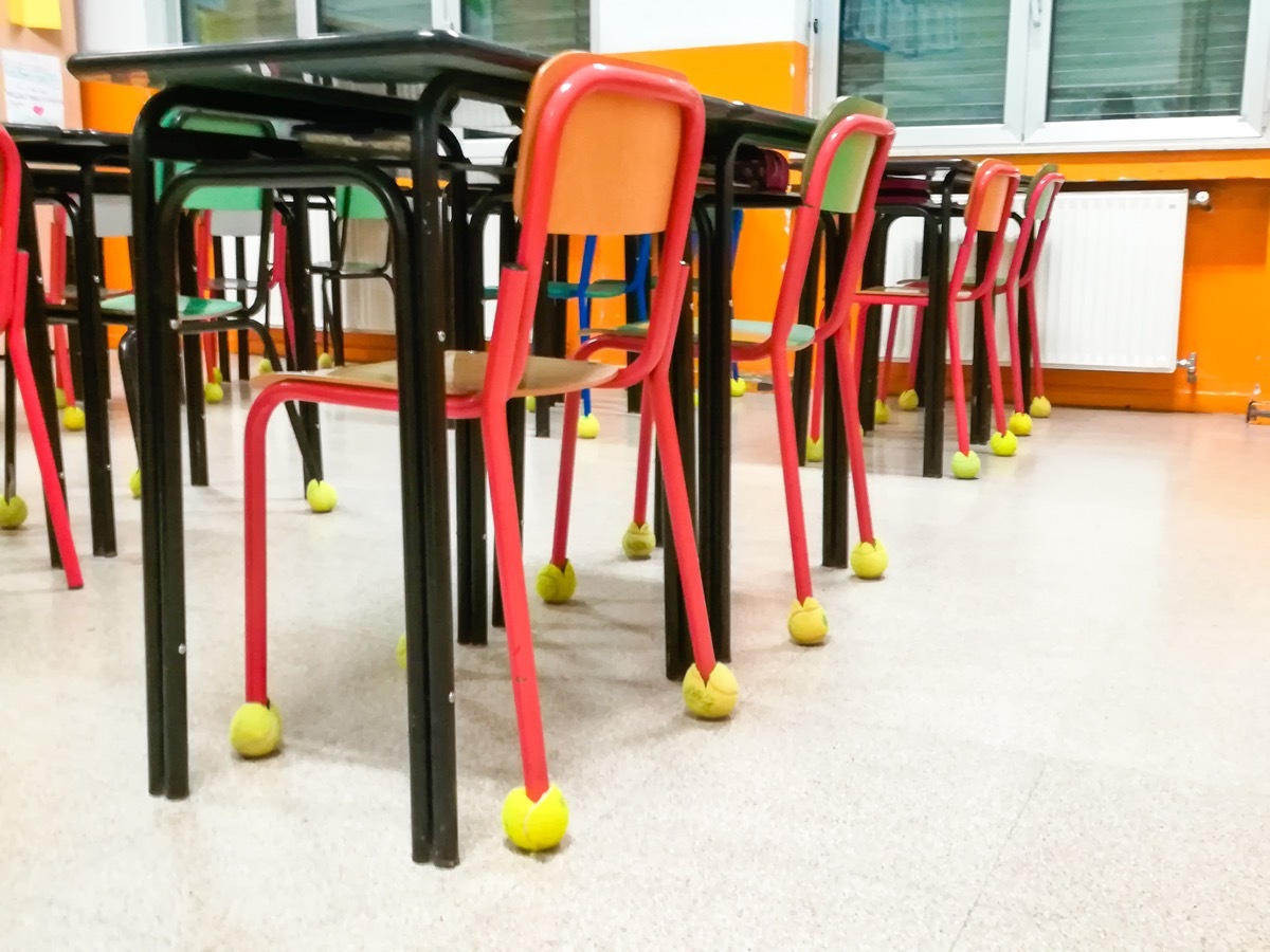 Classroom chairs in a row with tennis ball like bumpers