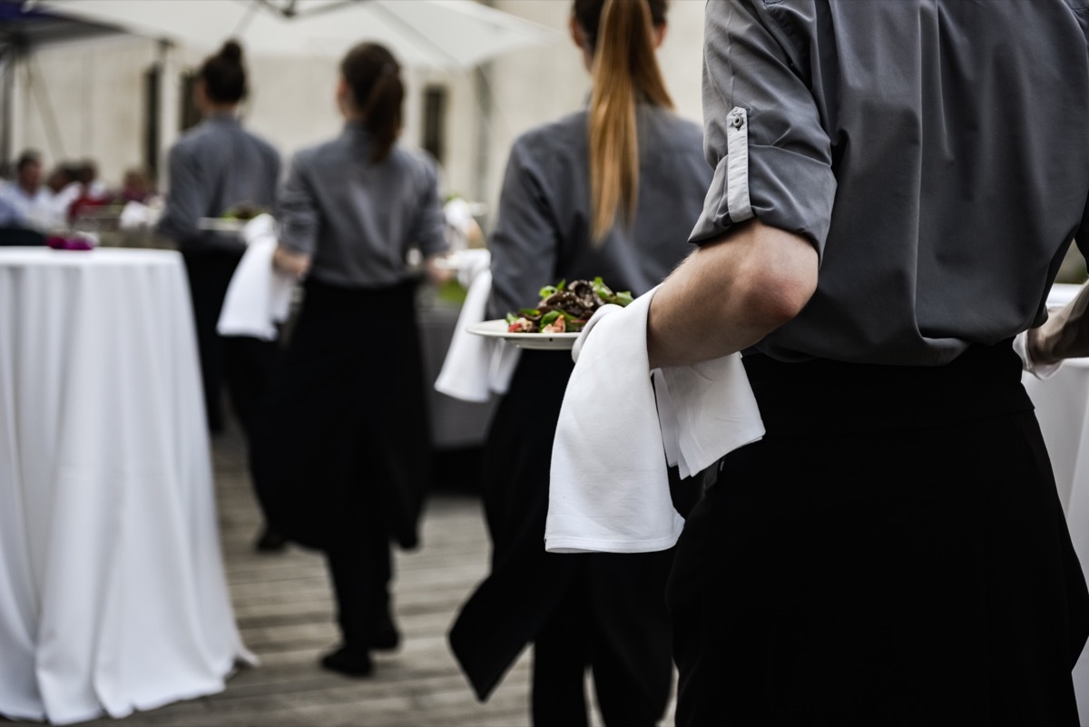 wedding staff serving dinner