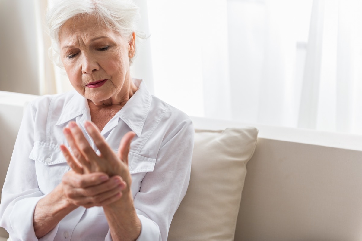 old woman rubbing her wrist