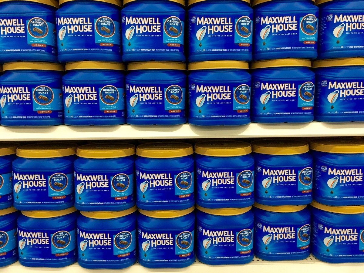 Store display with bulk blue containers of Maxwell House Coffee, state fact about tennesee