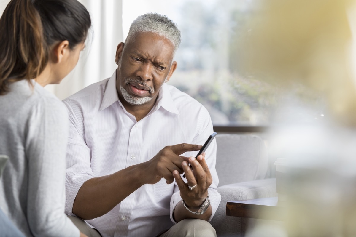 man confused talking to woman