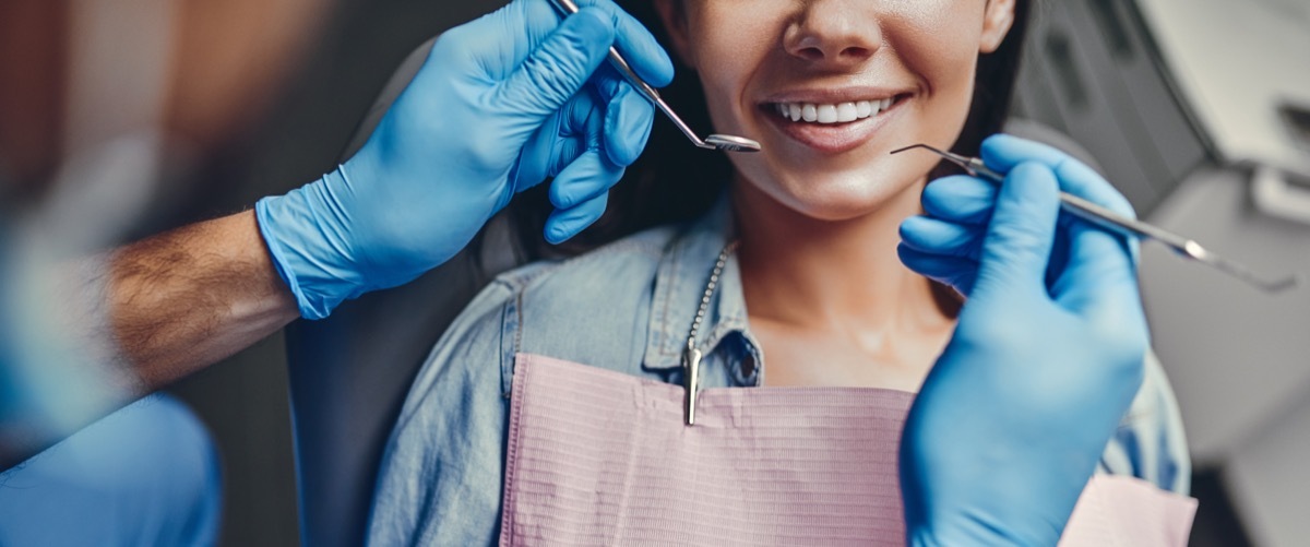 Woman Smiling While at the Dentist