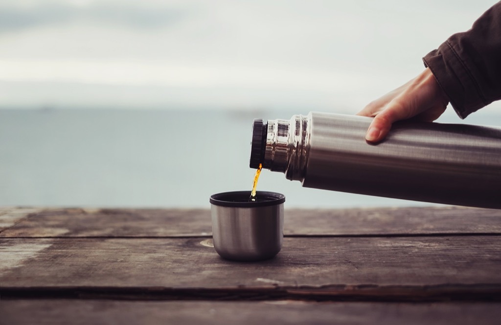 woman pouring coffee from thermos