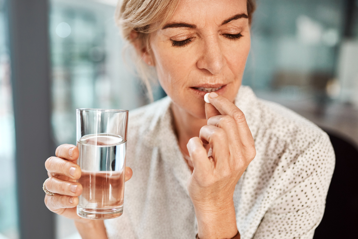 woman taking vitamin