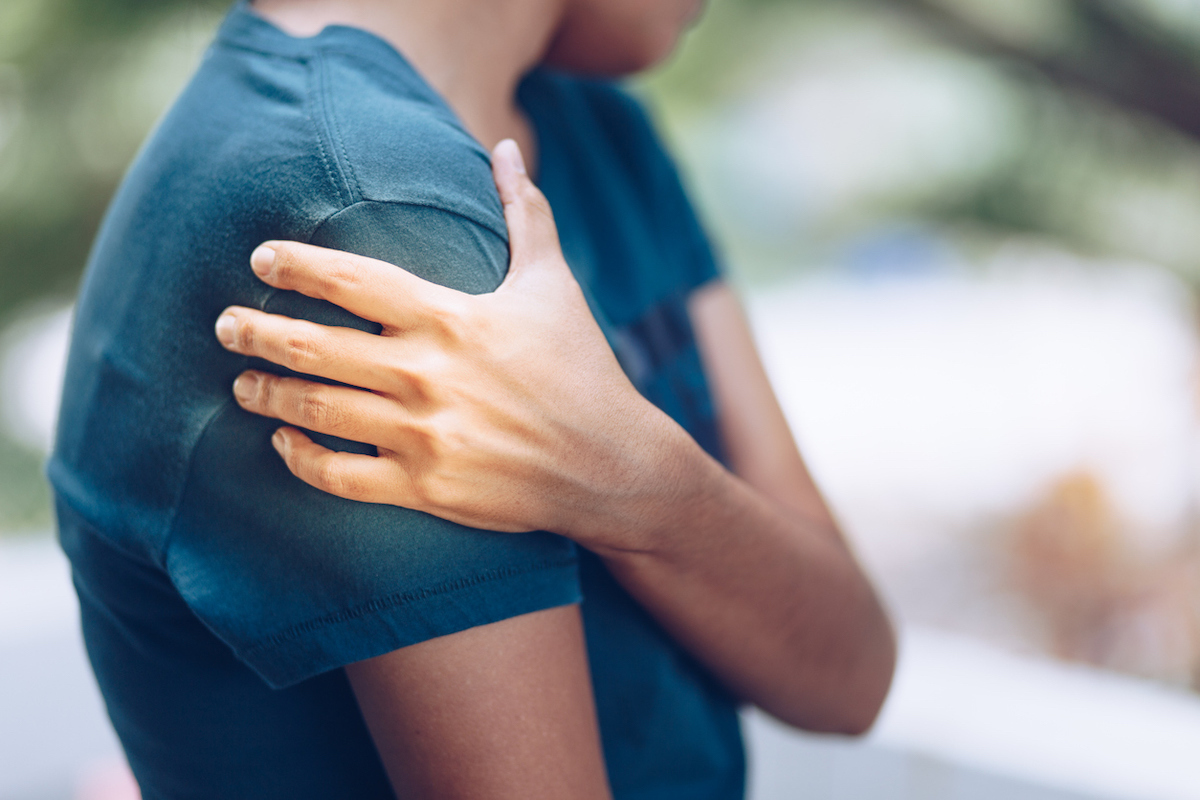 Woman with pain in upper arm